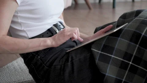 Female hands typing message, browsing internet on tablet at home. Stock Footage 131861046