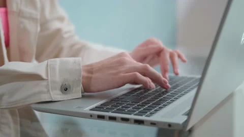 Female hands typing on notebook keyboard studying technology online Video stock 144662146