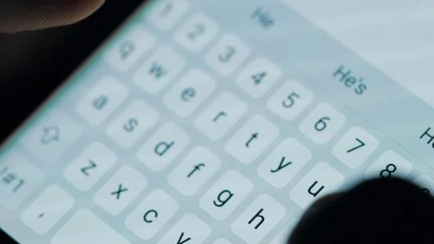Female hands typing or texting with a smartphone. White, back-lit background. Stock Footage