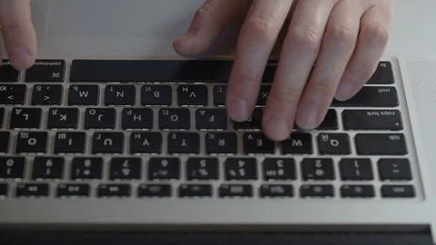 Female hands typing text on the laptop keyboard, top view Stock Footage 74687213