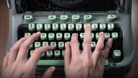 Female hands typing text on an old hebrew typewriter Stock Footage 132994839