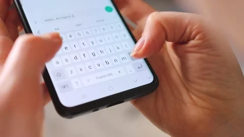 Female hands typing text on smartphone close-up. Stock Footage 346728215