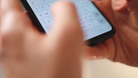 Female hands typing text on smartphone close-up. Stock Footage 346911898