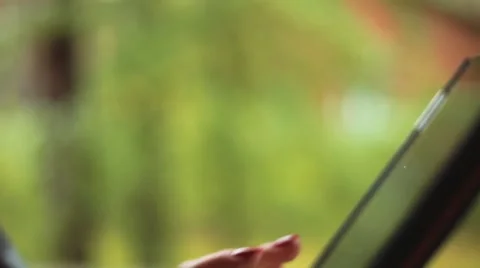 Female hands typing on touch screen bokeh Stock Footage 58337379
