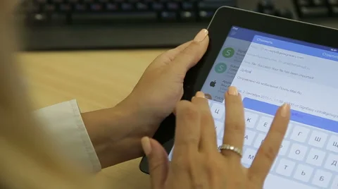 Female hands typing on touchpad on the table Stock Footage 61318978