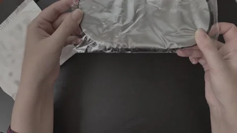 Female hands unpack the parcel. Video stock 205423010