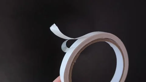 Female hands unwrap double-sided tape. Adhesive tape for crafts, repairs. Stock Footage 315152239