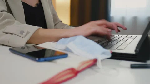 Female hands user worker using typing on laptop. Medical mask. Stock Footage 152678737