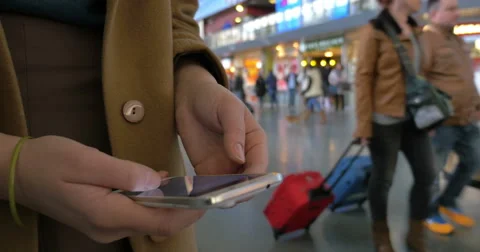 Female hands using cell phone at the station Video stock 51663760
