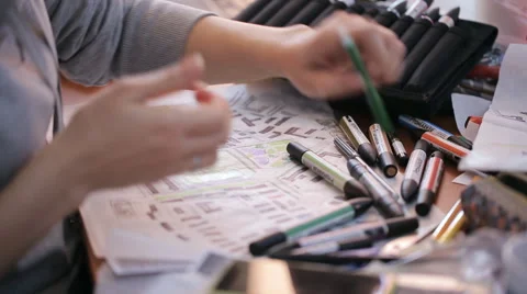 Female hands using colored markers painting the map, scheme or plan Stock Footage 64295874