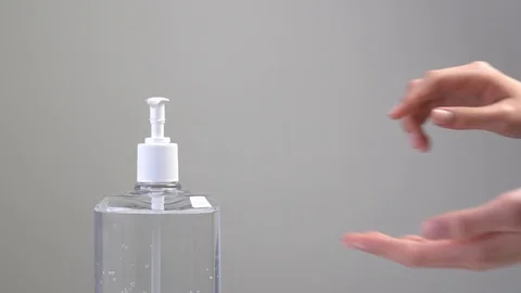 Female hands using hand sanitizer Stock Footage 125962588