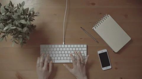 Female hands using keyboard on white wooden table, close up. Видео 61673412