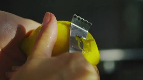 Female hands using a lemon zester Stock Footage 45150779