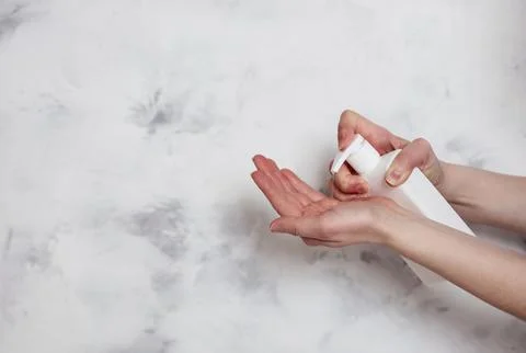 Female hands using liquid soap Stock Photos