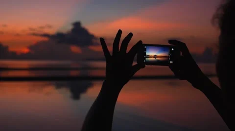Female Hands Using Mobile Phone at Sunset Stock Footage 58233240