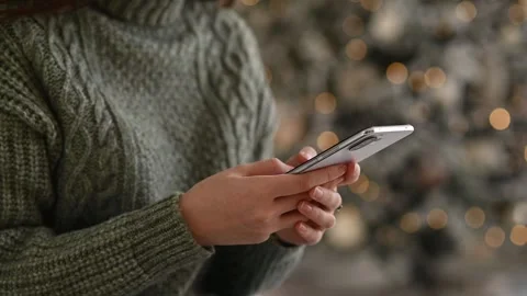 Female hands using smartphone close-up, online christmas and holiday shopping 스톡 동영상 254117738