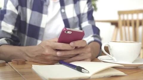 Female Hands Using Smartphone in Coffee Shop Stock Footage 77610442