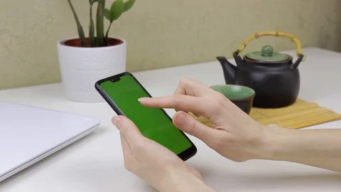 Female hands using a smartphone with green screen Stock Footage 127838210