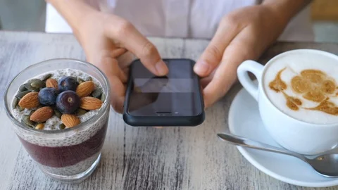 Female Hands Using Smartphone While Having Healthy Breakfast Stock-Footage 100067474