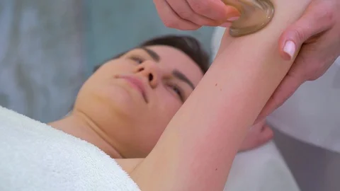 Female hands using vacuum cups on woman shoulder for massage Stock Footage 114605606