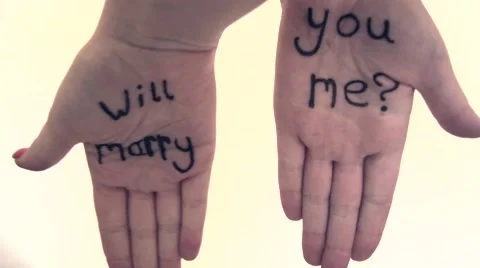 Female hands with Will you marry me written on them, marriage proposal Stock Footage 47749005