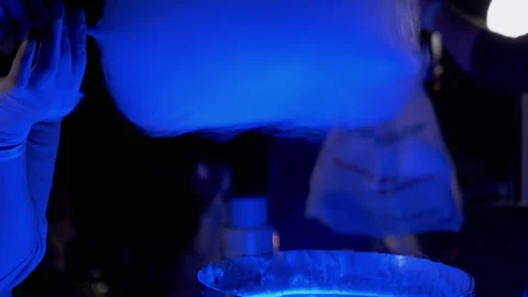 Female Hands Wind an Air Cloud of Cotton Candy from Sugar on a Wooden Stick Stock Footage 156394554