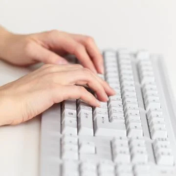 Female hands work on computer keyboard Stock Photos