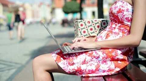 Female hands working on laptop computer in the city HD Stock Footage 11737839