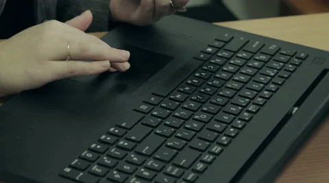 Female hands working on a laptop computer keyboard Stock Footage 59421616