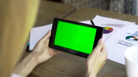 Female hands working in the office with tablet-pc, on wooden table, close-up Stock Footage 67648101