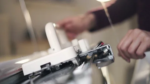 Female hands working on weaving machine for making knitted texture Stock Footage 87453413