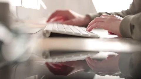 Female hands working on a white computer keyboard. Workplace of the programmer.  Stock Footage 99981108