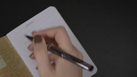 Female hands write To Do list numbering 2020 on blank striped notebook Stock-Footage 121800287