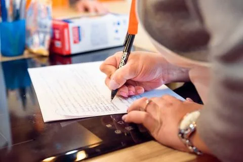 Female hands write down recipe Stock Photos