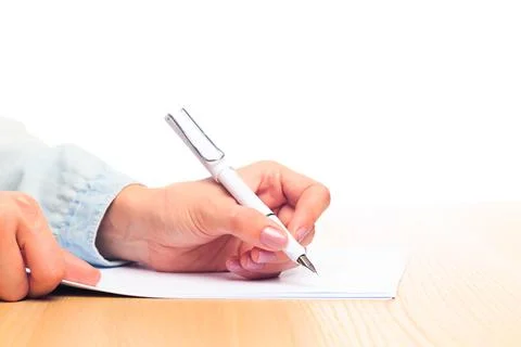 Female hands write in a notebook . Office place Stock Photos