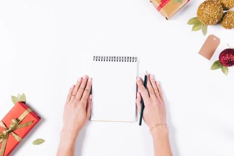 Female hands write in a notebook 库存照片