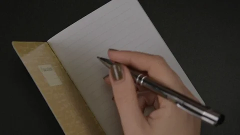 Female hands write with pencil To Do list on blank striped notebook Stock-Footage 121800394