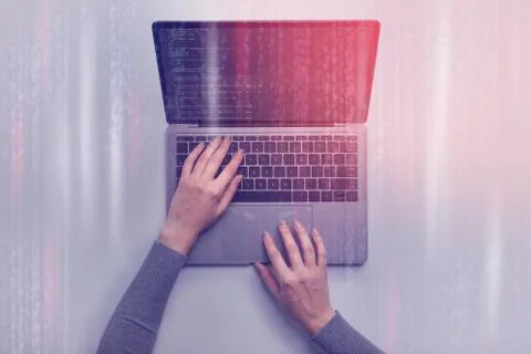 Female hands writing code on laptop. Dual screen, collage Foto stock