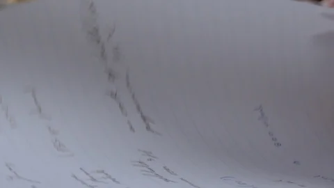 Female hands writing down notes and drawings on note block. Stock Footage 118047633