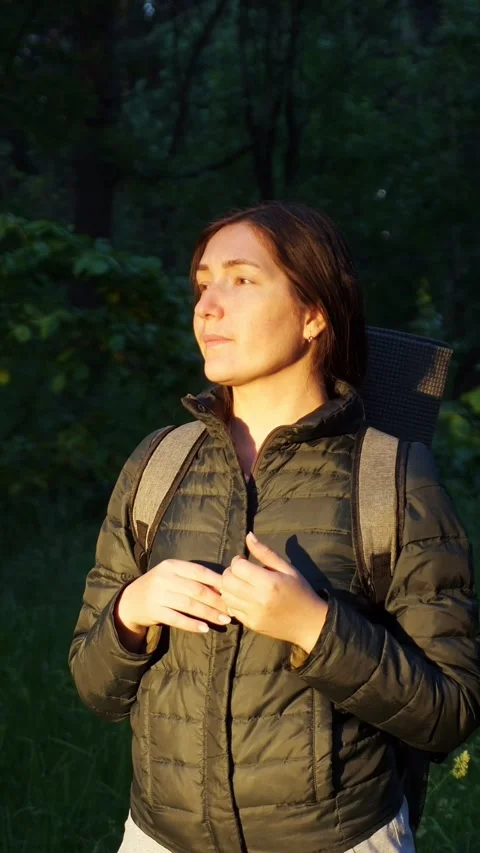 Female hiker with a backpack lost in the forest calling for help while trekking Stock-Footage 341677887