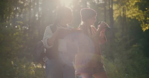 Female Hikers Exploring Forest During Sunny Day Stock Footage 252018892
