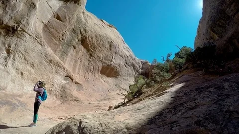 Female hikes Arches Stock Footage 79576764