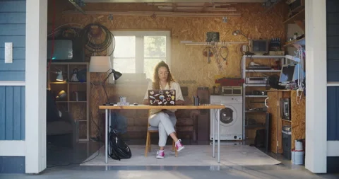 Female Hispanic Developer Using Computer In Retro Garage Stock Footage 255996870