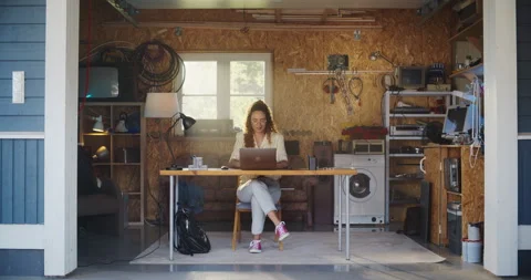 Female Hispanic Developer Using Computer In Retro Garage Stock Footage 255996889