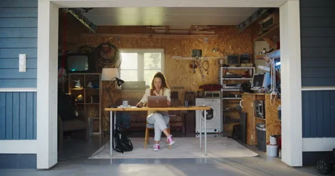 Female Hispanic Developer Using Computer In Retro Garage Stock Footage 255996903