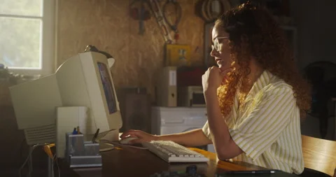 Female Hispanic Developer Using Computer In Retro Garage Stock Footage 255997388