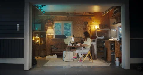 Female Hispanic Developer Using Computer In Retro Garage Stock Footage 255999692