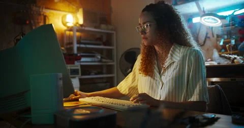 Female Hispanic Developer Using Computer In Retro Garage Stock Footage 256000035