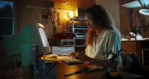 Female Hispanic Developer Using Computer In Retro Garage Stock Footage 256000051