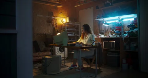Female Hispanic Developer Using Computer In Retro Garage Stock Footage 256000071